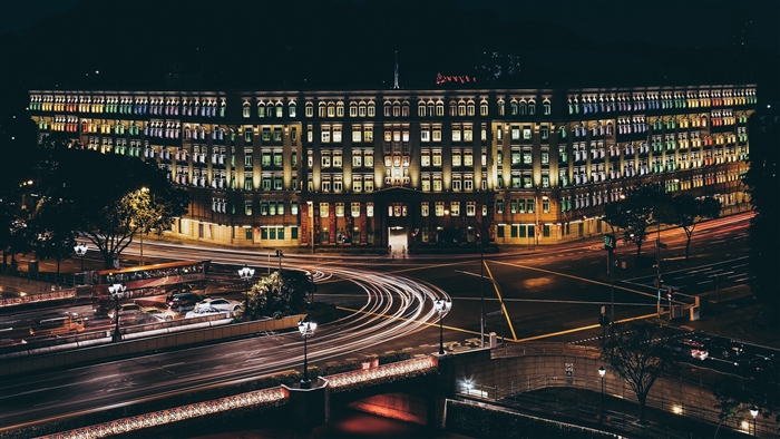 Singapore building at night with light trails 4K