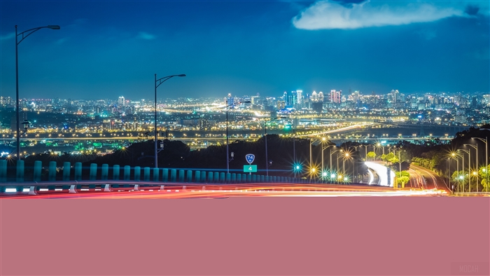 City lights at night with road and highway
