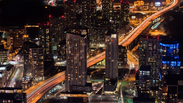 Cityscape Night View with Illuminated Skyscrapers and Roads