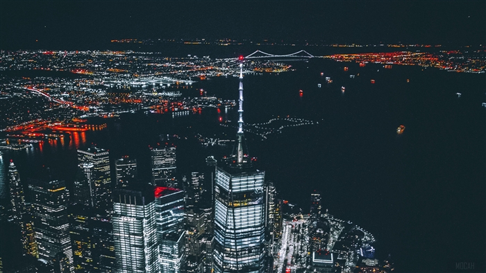 New York City skyscrapers at night with bridge
