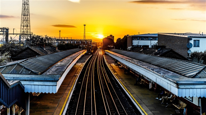 Train station tracks at sunset 4K