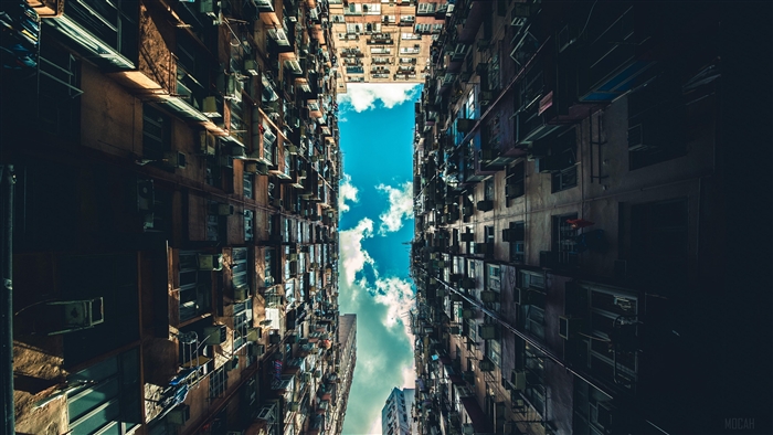 Apartment buildings viewed from below with sky