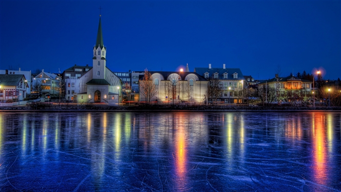 Reykjavik Iceland cityscape with frozen lake at night 4K
