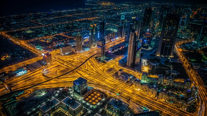 Dubai Cityscape at Night with Highway Interchange 4K