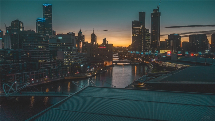 Cityscape with River and Buildings at Dusk 4K