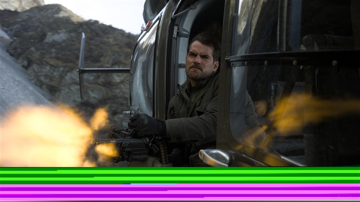 Henry Cavill firing a gun from a vehicle in Mission Impossible Fallout 4K