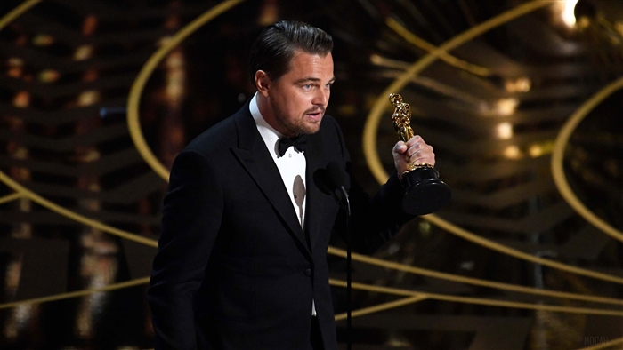 Leonardo DiCaprio holding an Oscar award