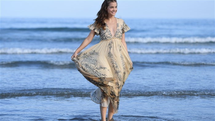 Barbara Palvin in a flowing dress on the beach