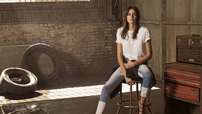 Kaia Gerber in a garage setting