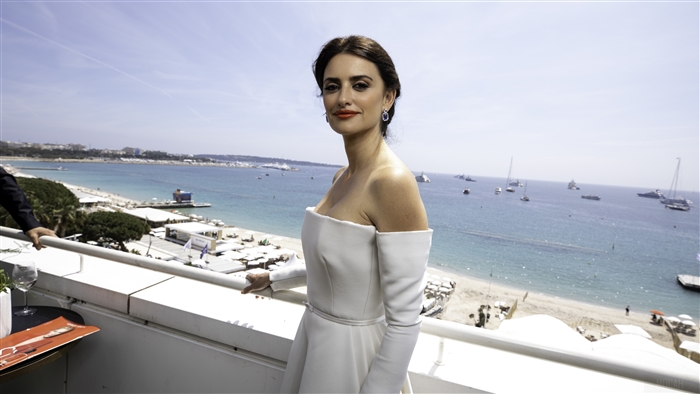 Penelope Cruz on a balcony overlooking the sea