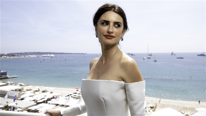 Penelope Cruz on a balcony overlooking the sea