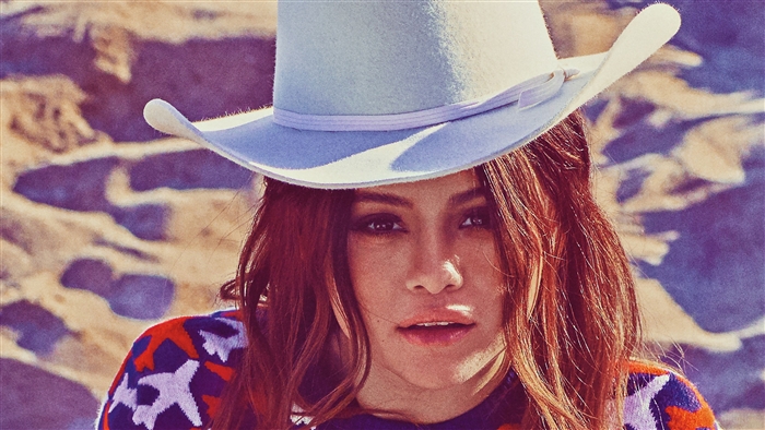 Selena Gomez in a hat and sweater