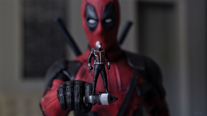 Ant-Man standing on Deadpool's gun