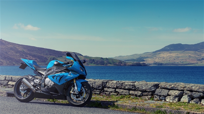 Blue BMW S1000RR motorcycle parked by a lake