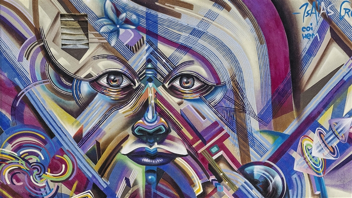 Graffiti street art of a stylized face