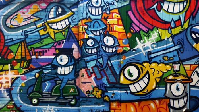 Graffiti art with cartoon characters on a brick wall