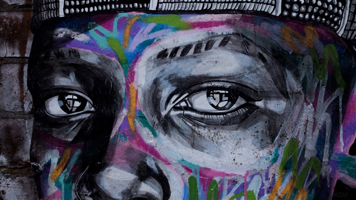 Graffiti art of a face with colorful paint