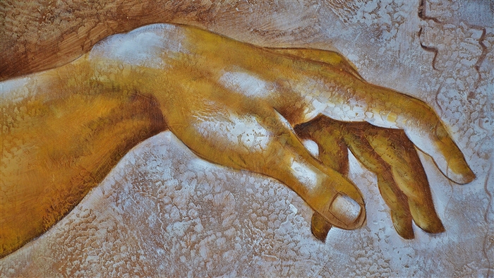 Close-up of a painted hand with textured background