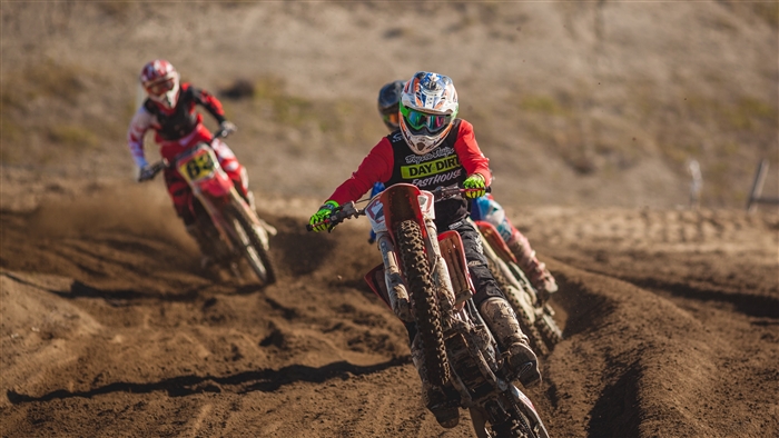 Motocross riders racing on a dirt track 4K