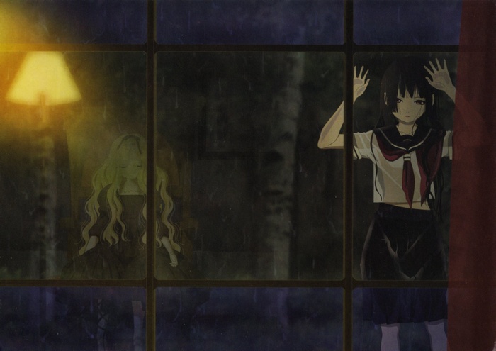 Two girls seen through a rainy window