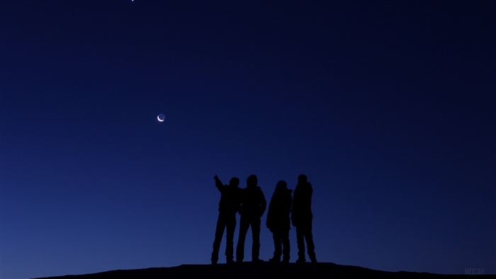 People looking at the moon and Venus in the night sky 4K