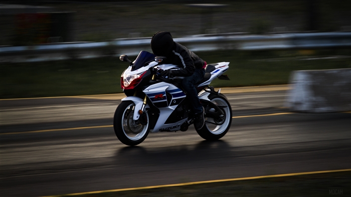 Suzuki motorcycle rider in motion