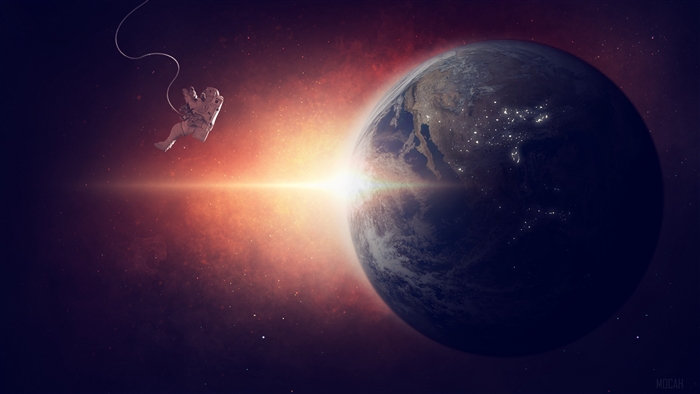 Astronaut floating in space near Earth