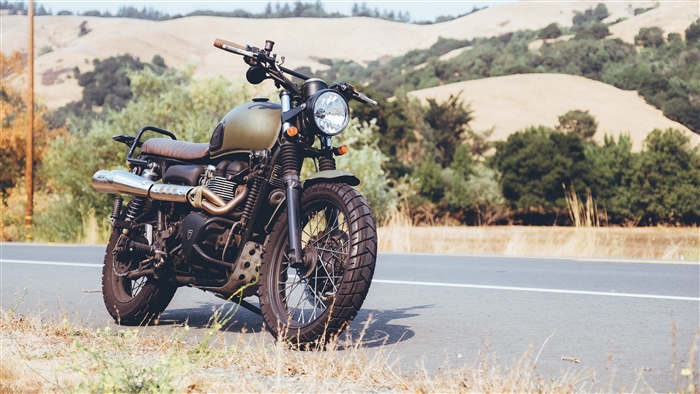 Motorcycle parked on the side of a road