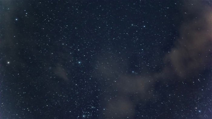 Starry night sky with clouds