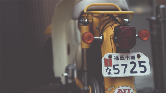 Yellow scooter with license plate 5725 4K
