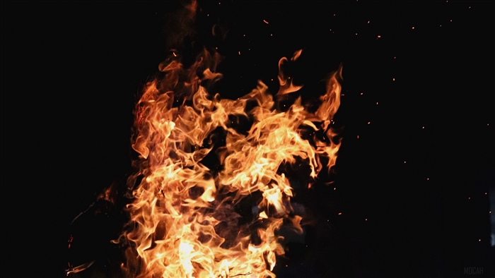Fire and embers against a dark background