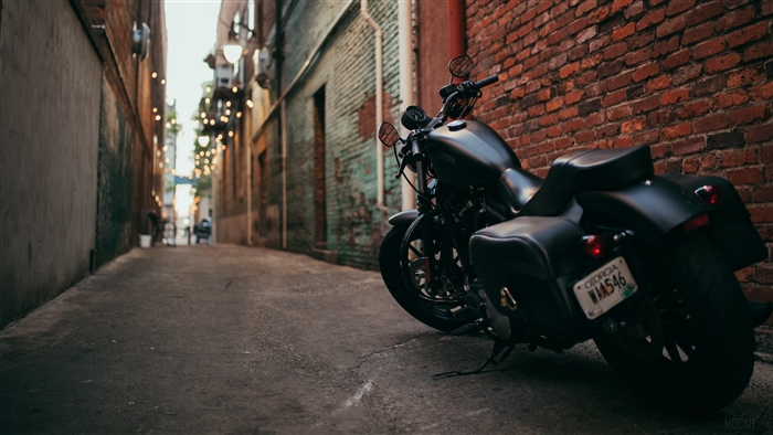 Black motorcycle parked in alley with Georgia license plate