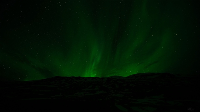 Aurora Borealis over a dark landscape 4K