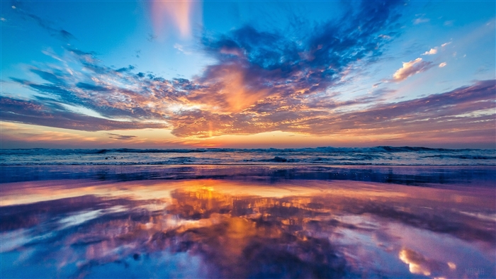 Sunset Reflection on a Beach