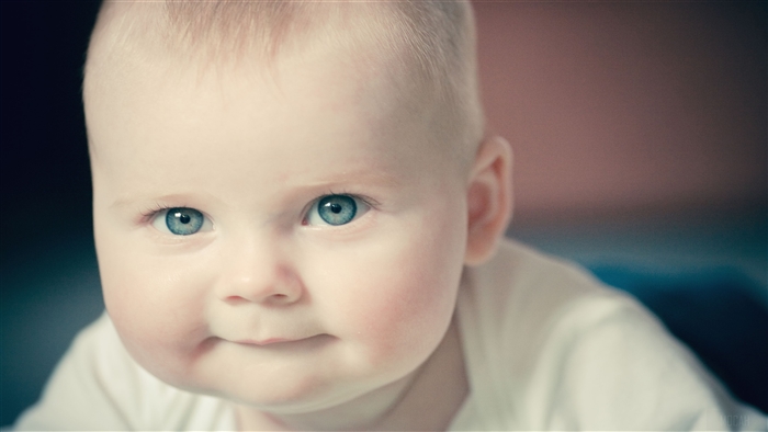 Close-up of a cute baby with blue eyes