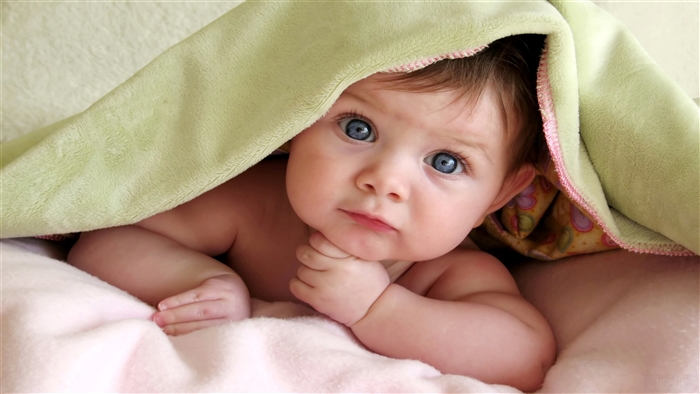 Adorable Baby with Blue Eyes Under Blanket 4k