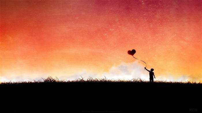 Silhouette of a child holding a heart balloon at sunset
