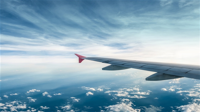 Airplane Wing Flying Above Clouds 4K