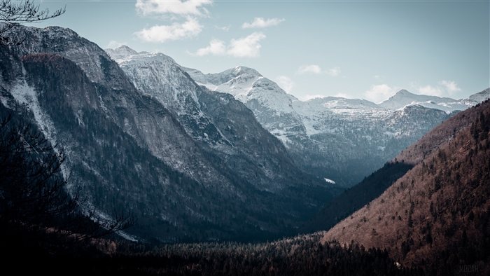 Snow-capped mountain peaks in a valley