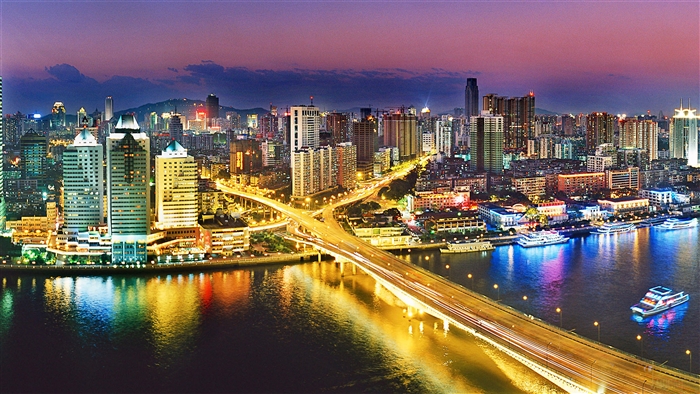 Guangzhou City Skyline at Night with River and Bridge