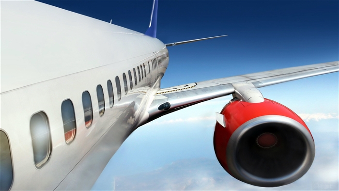Airplane engine and wing in flight