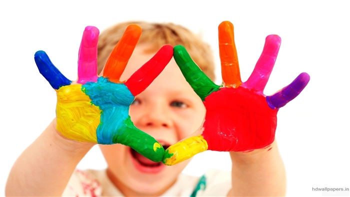 Child with colorful painted hands