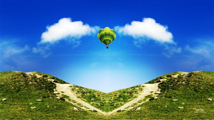 Hot air balloon over hills