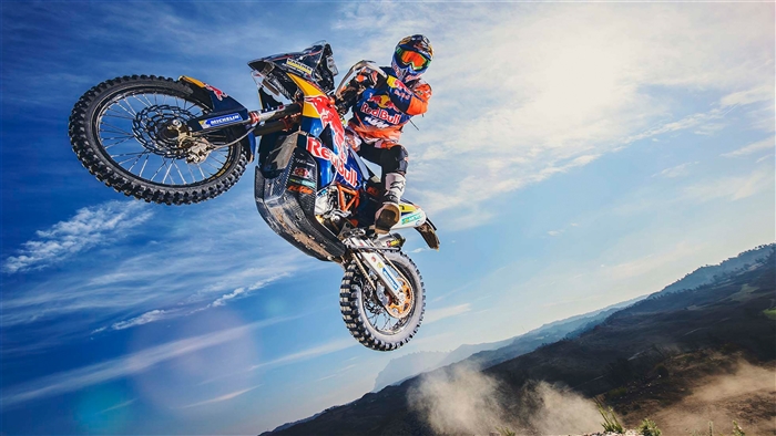 KTM 450 Rally motorcycle rider in mid-air