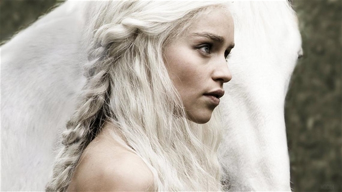 Emilia Clarke as Daenerys Targaryen with a white horse