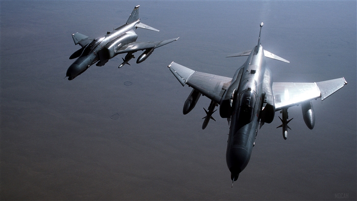 Two F-4 Phantom II "Wild Weasel" aircraft in flight