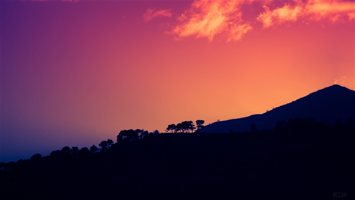 Sunset over dark mountains with trees 4K