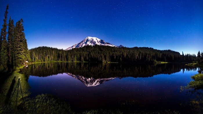 Mount Rainier reflected in a lake at night
