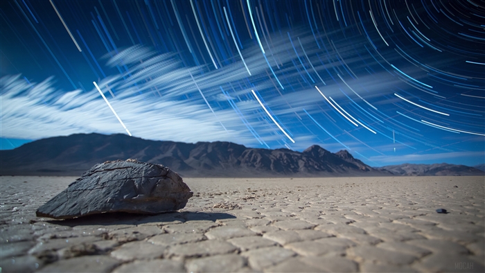 Star Trails Over Desert Landscape