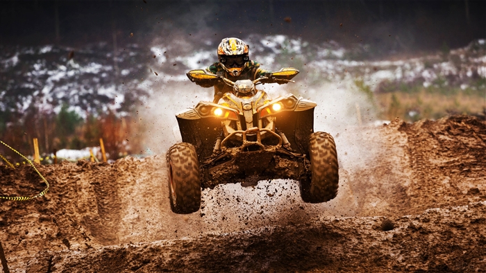 ATV rider jumping over mud in 4K